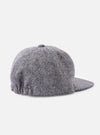 Back view of a cableami® Black/White Recycled Tweed Cap on a white background. The cap is made of black and white tweed and has a classic fit.