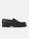 Studio shot of a Paraboot Black Leather Reims Marche shoe. The black leather loafer has a thick sole. Clean white background.