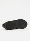 Close-up of the sole of a Paraboot Black Leather Reims Marche shoe, showcasing its thick, textured rubber sole against a clean white background.
