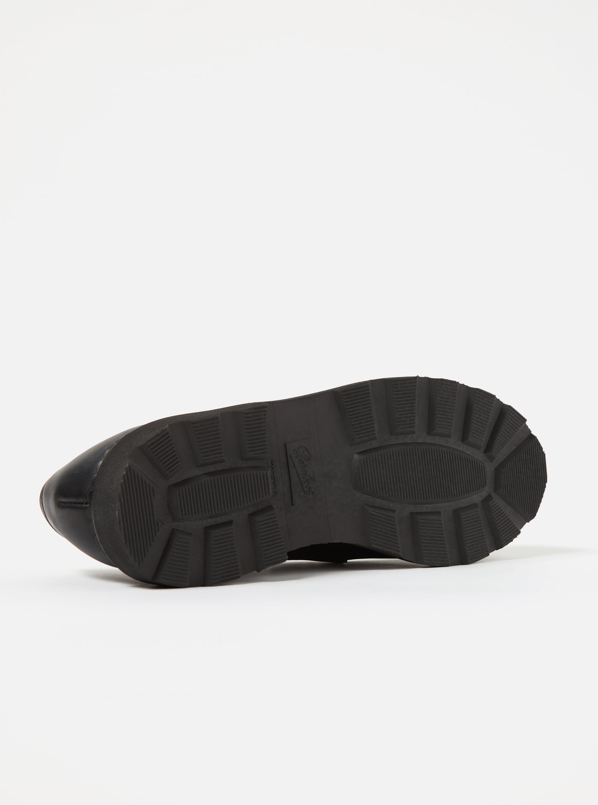 Close-up of the sole of a Paraboot Black Leather Reims Marche shoe, showcasing its thick, textured rubber sole against a clean white background.
