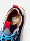 The Flower Mountain Navy/Azure Suede/Nylon Wave Man sneaker is shown from a rear three-quarter angle against a plain white background. The image highlights the technical navy nylon and azure suede upper, the webbing back pull tab, and the thick, off-white notched edge rubber sole.