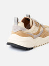 The Flower Mountain Beige/Cream/Light Grey Suede/Nylon Wave Uni is shown from a side profile against a white background. The sneaker features a technical mesh and nylon upper in beige and cream with overlapping light grey suede overlays. It has a distinctive nature-inspired perforated pattern on the suede, a notched edge rubber gum sole, and a webbing back pull tab.
