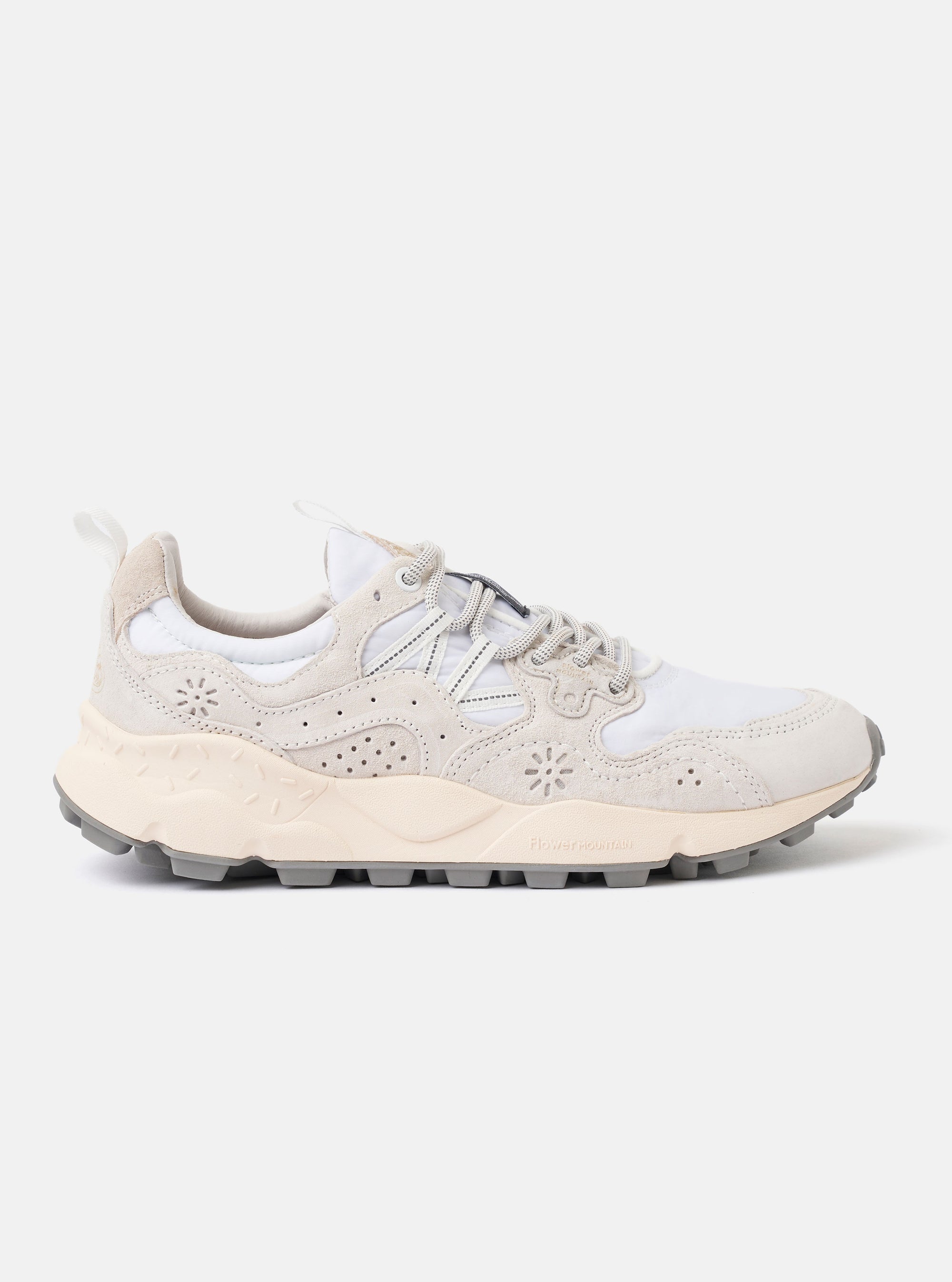 The Flower Mountain White/Off White Suede/Nylon Yamano 3 Uni is shown from a side profile against a plain white background. The sneaker features a technical white nylon upper with off-white suede overlays, trekking-style laces, and reinforced eyelets. The design highlights signature nature-inspired perforated patterns and a chunky, notched-edge rubber sole.