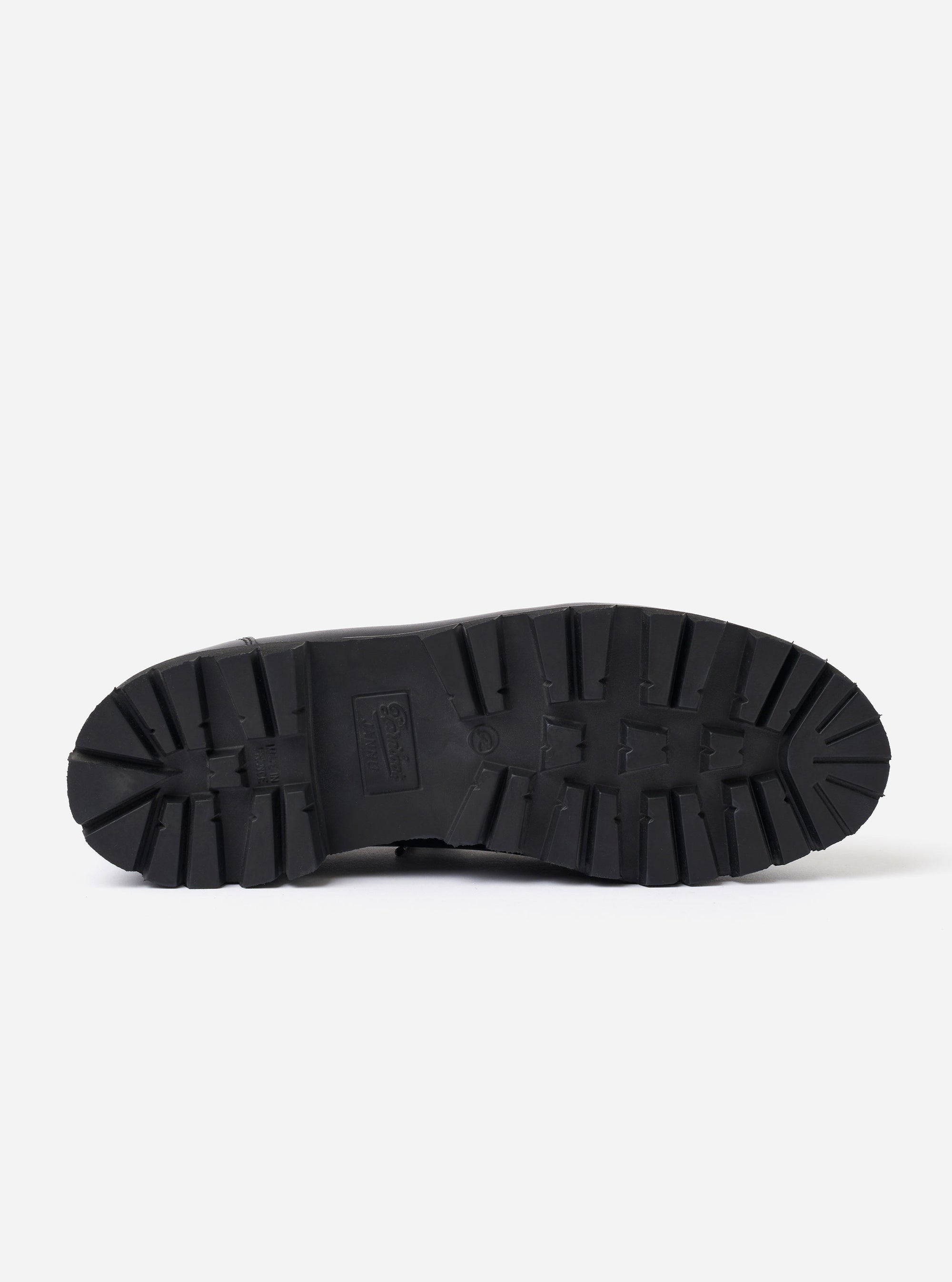 The Paraboot Black Leather Clusaz Jannu is shown in a side-profile view as a flat lay against a plain white background. The low-cut hiking boot features a smooth black leather upper, silver-tone D-ring metal eyelets with black rope laces, and a prominent Norwegian welt connecting the upper to a chunky black rubber lug sole.