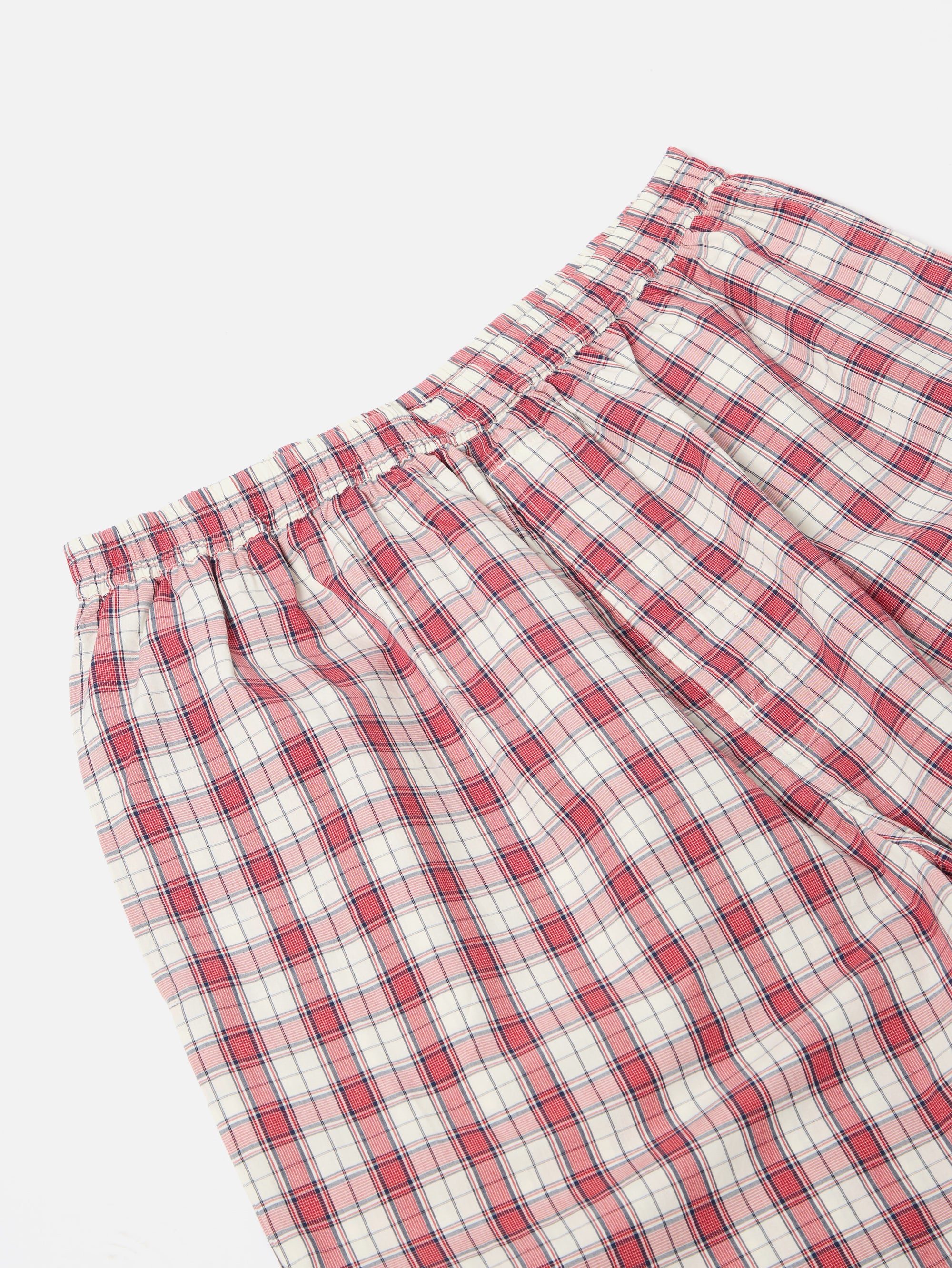 Close-up of the Red Cotton Check Pyjama Pant on a white background. The red and white checkered pattern is visible, showcasing the soft cotton material.