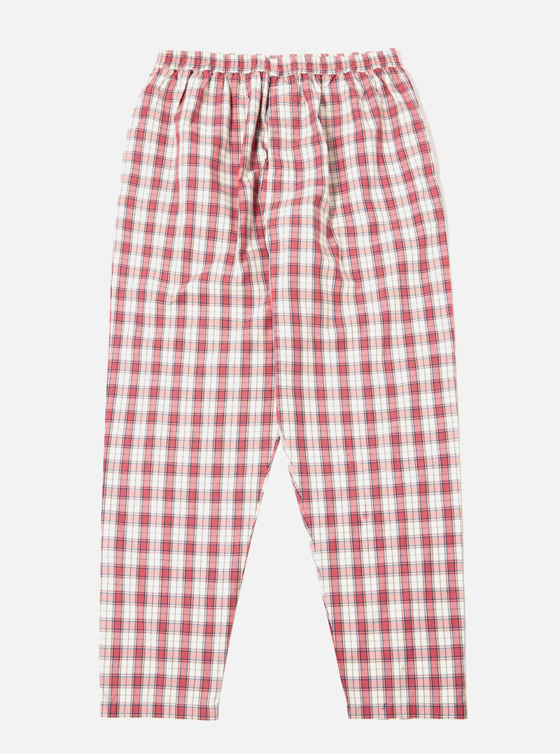 The Red Cotton Check Pyjama Pant, laid flat on a white background. The pyjama pants are red and white with an elastic waist.