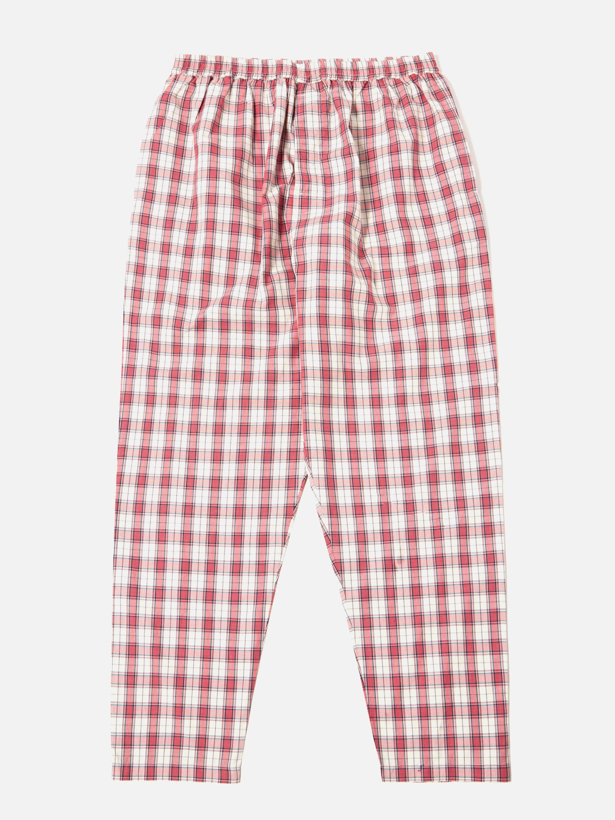 The Red Cotton Check Pyjama Pant, laid flat on a white background. The pyjama pants are red and white with an elastic waist.
