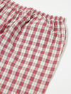Close-up of the Red Cotton Check Pyjama Short on a white surface. The red and white plaid pattern is visible, showcasing the soft cotton material and comfortable fit.