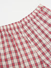 Close-up of the Red Cotton Check Pyjama Short on a white surface. The red and white plaid pattern is visible, showcasing the soft cotton material and comfortable fit.