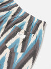 Close-up of Ecru Ikat II Cotton Boxer Short on a white background. Features blue, grey, and white ikat pattern, elastic waistband, and back pocket with button.