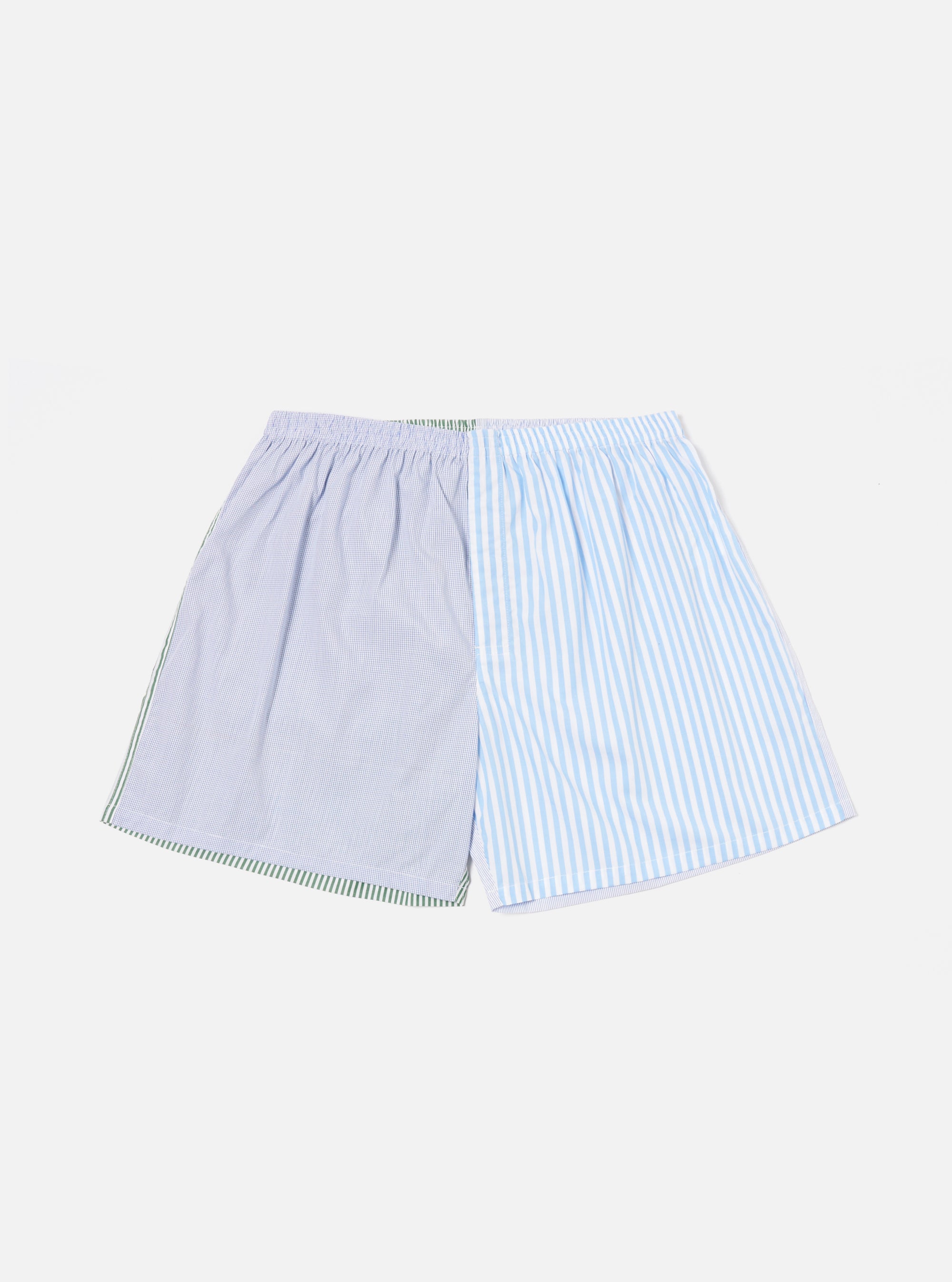 The Blue Classic Mix Boxer Short on a white background. The shorts are made of blue and white striped fabric, with a green trim on one side.