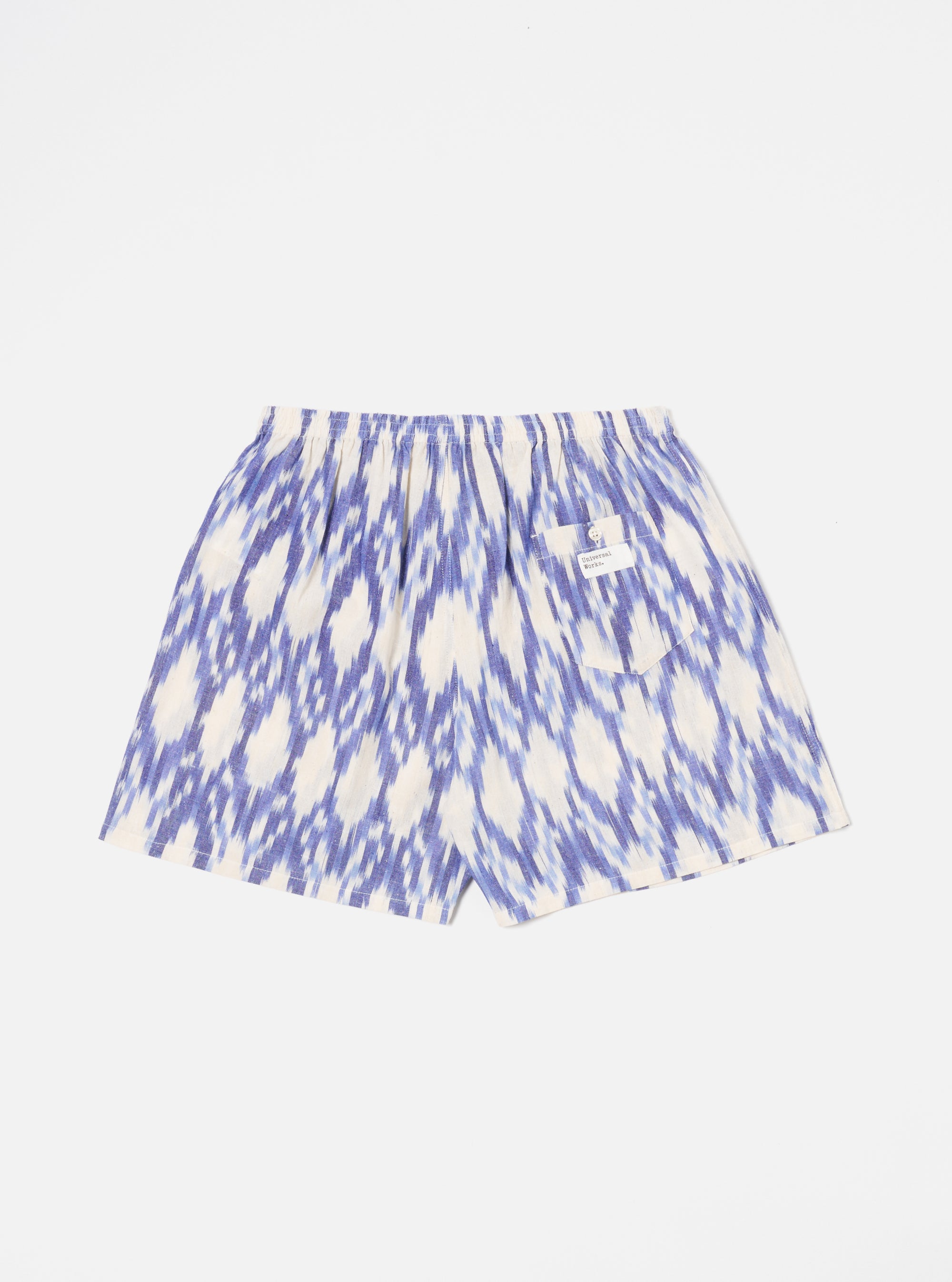 The Ecru Ikat I Cotton Boxer Short on a white background. The shorts are ecru with a blue ikat pattern and have an elastic waistband.