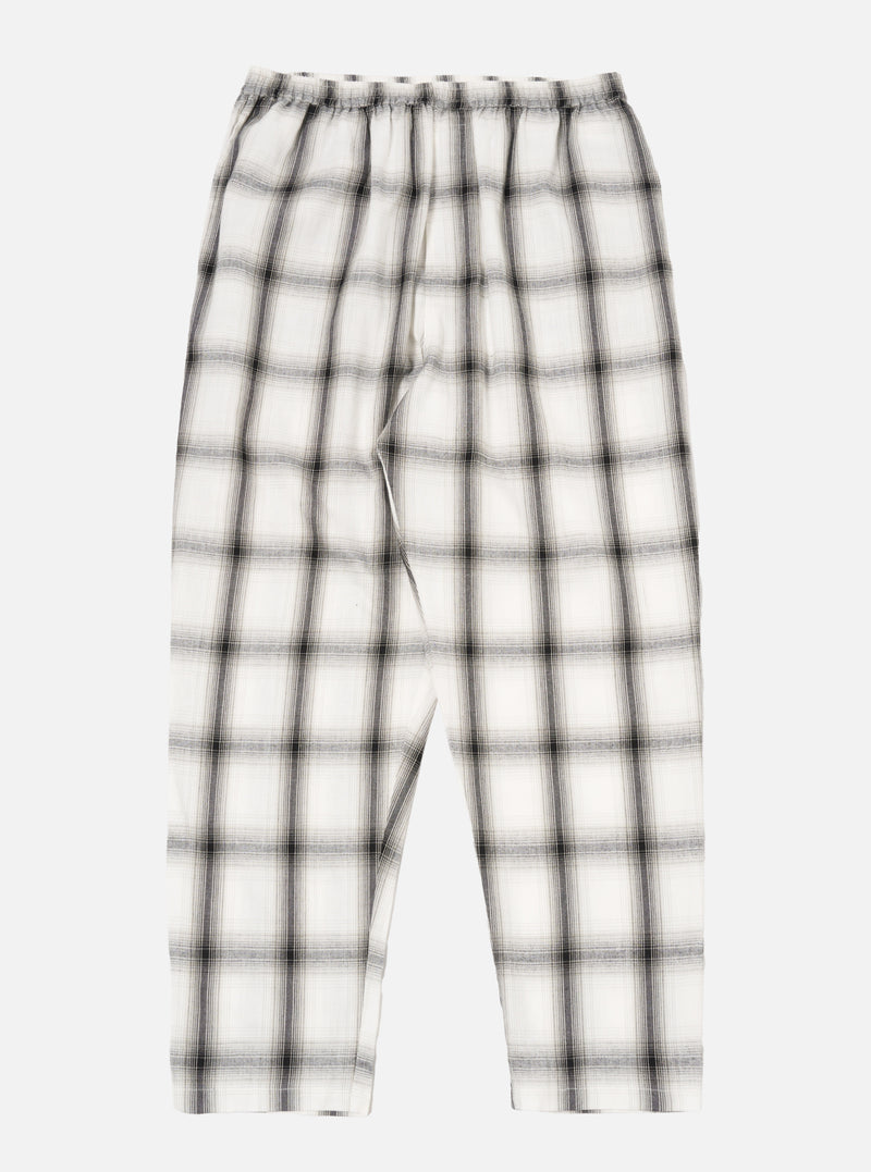 The Ecru Shadow Check Pyjama Pant, featuring a relaxed fit. The pants are ecru with a shadow check pattern. Shot on a white background.