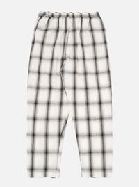 The Ecru Shadow Check Pyjama Pant, featuring a relaxed fit. The pants are ecru with a shadow check pattern. Shot on a white background.