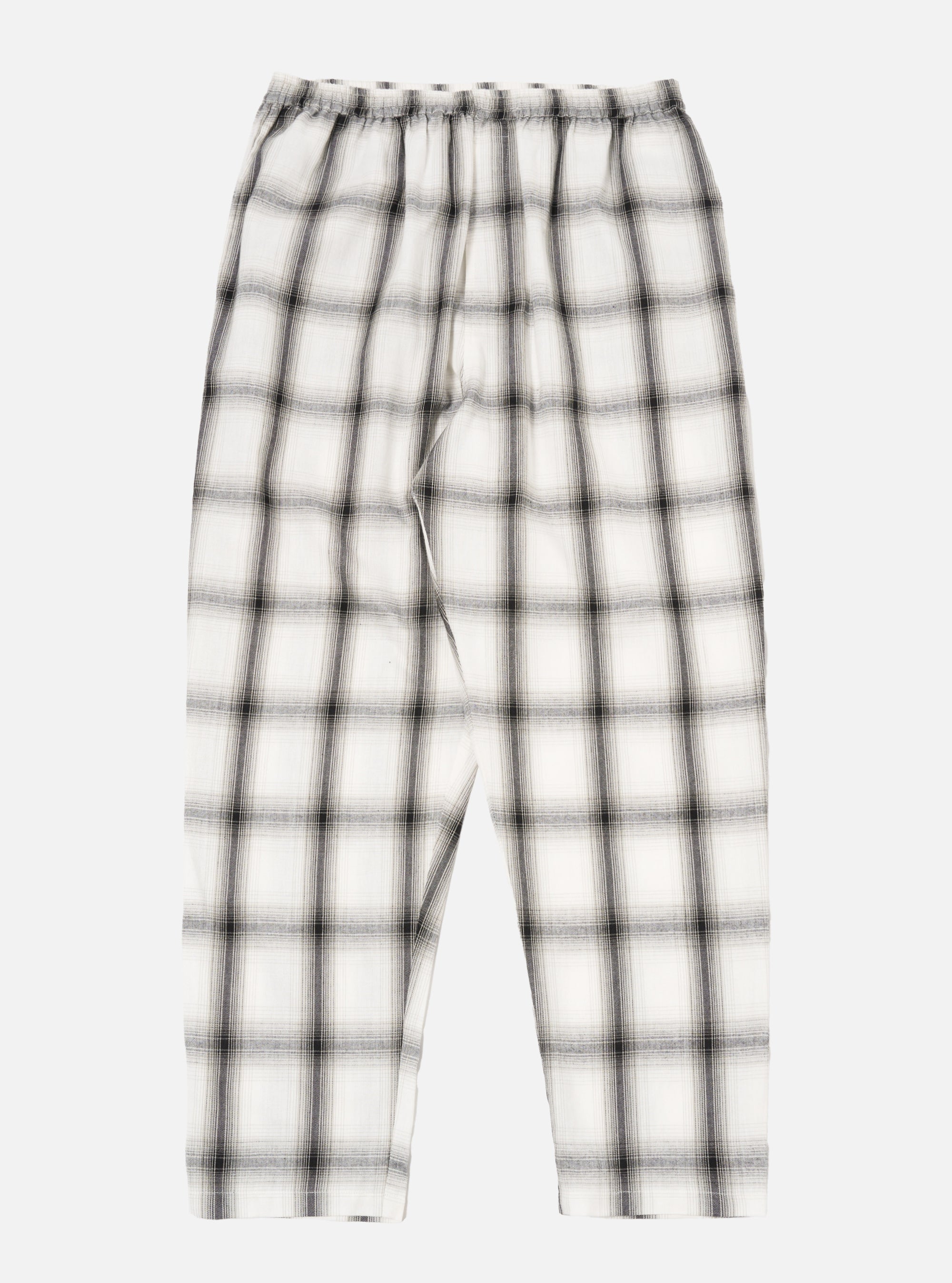 The Ecru Shadow Check Pyjama Pant, featuring a relaxed fit. The pants are ecru with a shadow check pattern. Shot on a white background.