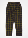 Flat lay of Olive JP Herringbone Check Pyjama Pant on a white surface. The pants have a relaxed fit and a yellow and brown check pattern.