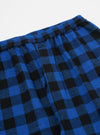 Close-up of the Blue Brushed Bold Gingham Pyjama Pant on a white background. The brushed fabric has a blue and black gingham pattern and an elastic waist.
