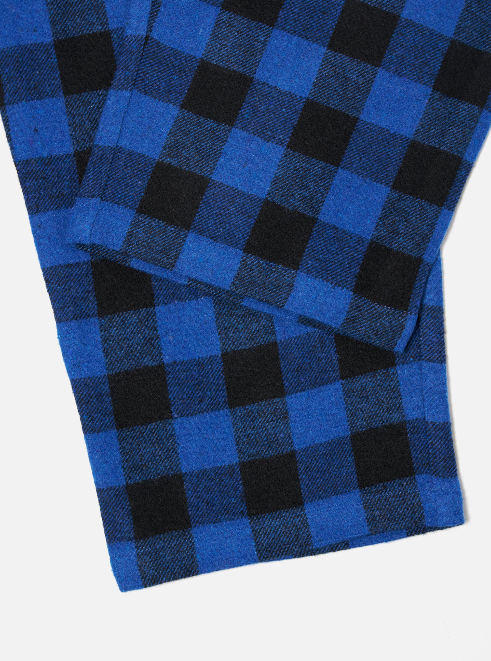 Close-up of the Blue Brushed Bold Gingham Pyjama Pant on a white surface. The brushed cotton fabric features a blue and black gingham pattern.