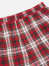 Close-up of the Red Madras Check Short Pyjama Set. Red, white, and green plaid pattern. Elastic waistband. Shot on a white background.
