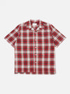 The Red Madras Check Short Pyjama Set top, laid flat on a white background. The short-sleeved shirt has a red, white, and yellow plaid pattern with a camp collar.