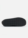 Close-up of the sole of the Zardus for Universal Works Black Leather Reggie Loafer, showing the textured black rubber against a white background.