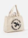 Studio shot of an Ecru Canvas Market Tote. The bag is ecru-colored canvas with black graphic print. The background is a plain white.