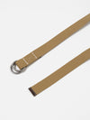 Close-up of a Dark Sand Canvas O Ring Belt on a white background. The canvas belt features a dark brown leather accent and silver-toned metal rings.