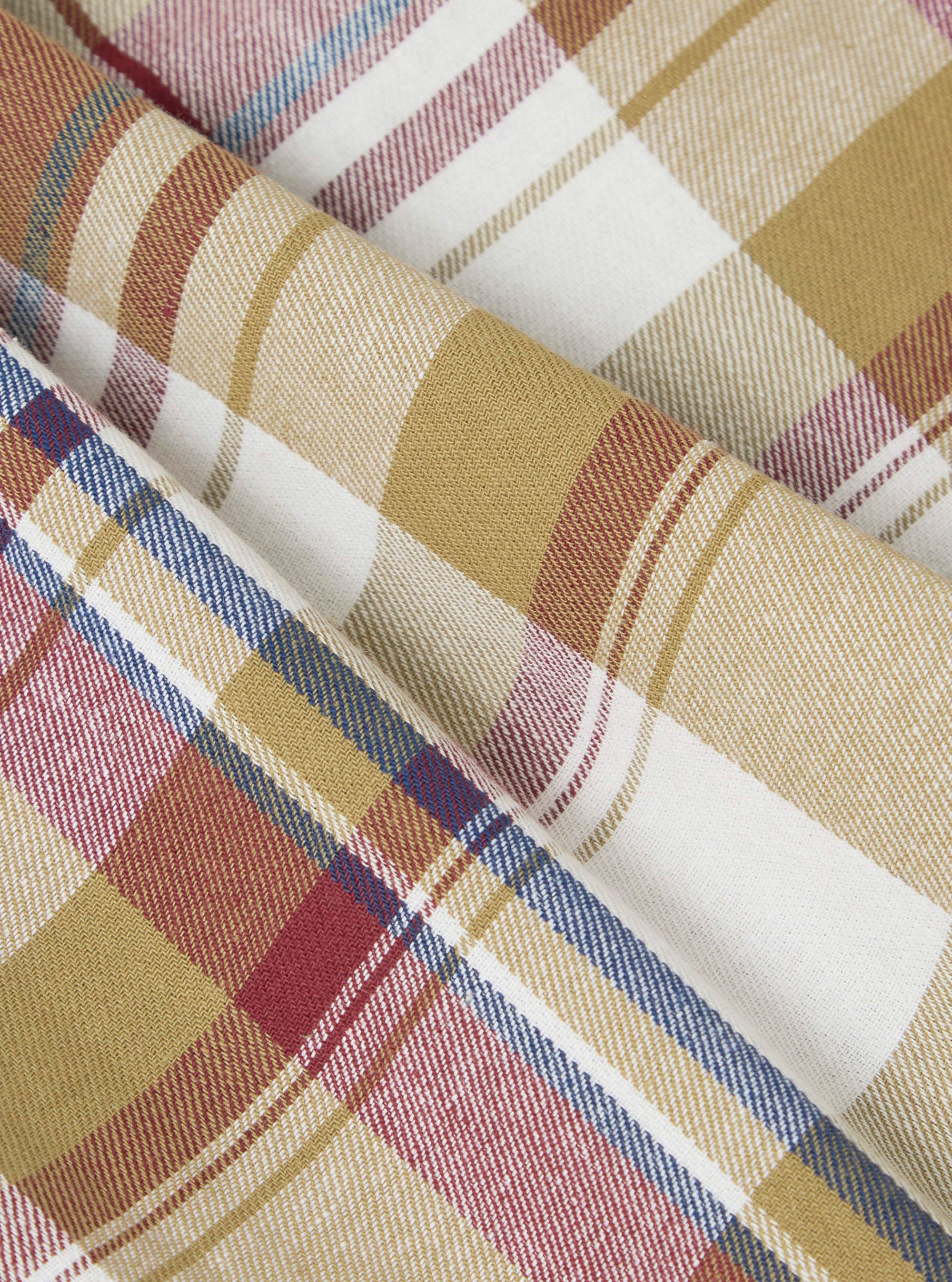 Close-up of the Multi Kip Check 3 Pack Boxer Short fabric. Features a soft, brushed cotton in a multi-colored plaid pattern with red, blue, and tan hues. 