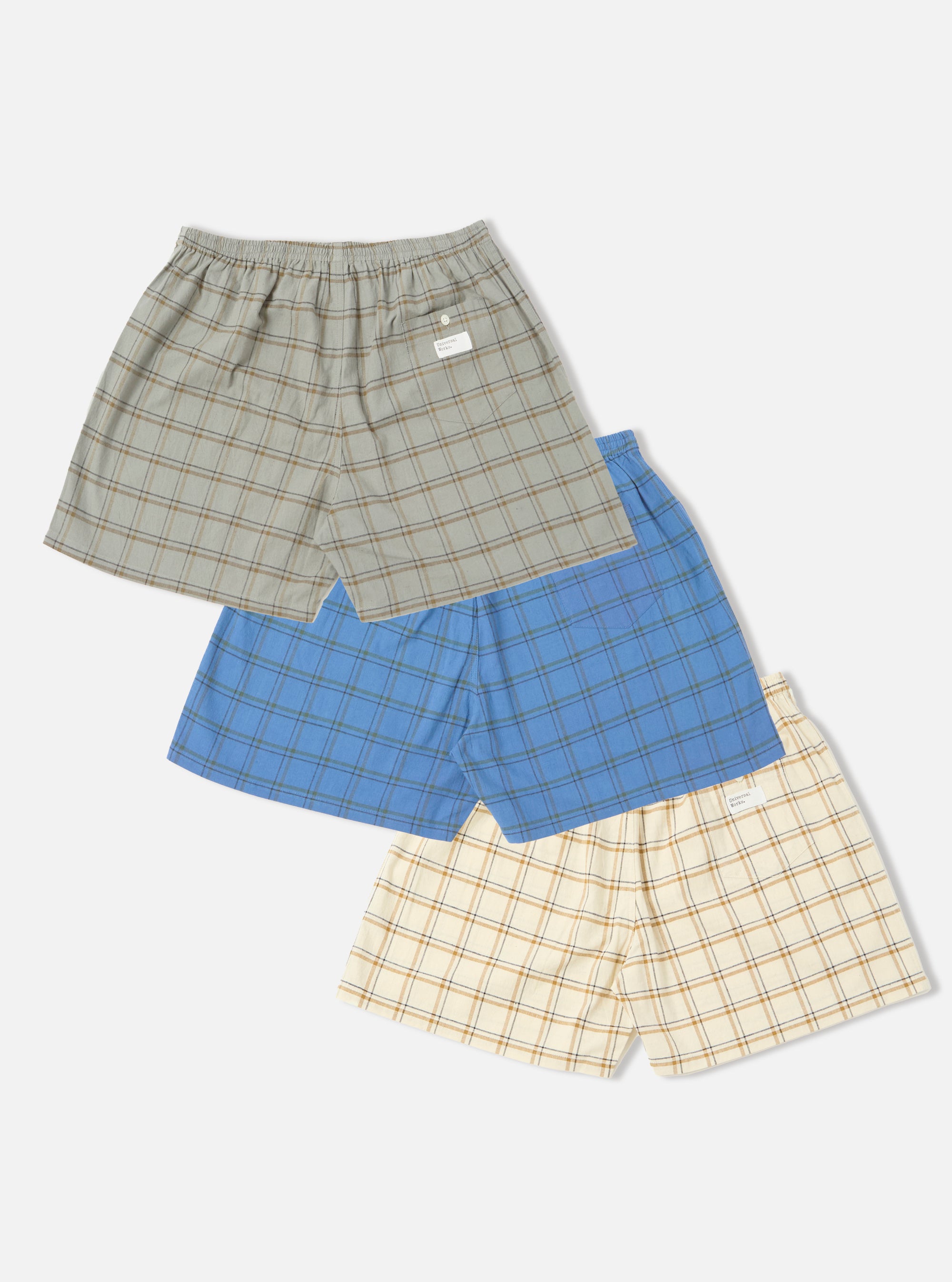 Stacked Multi PJ Plaid 3 Pack Boxer Short set. Colors include gray, blue and cream. Elastic waist. On a white background.