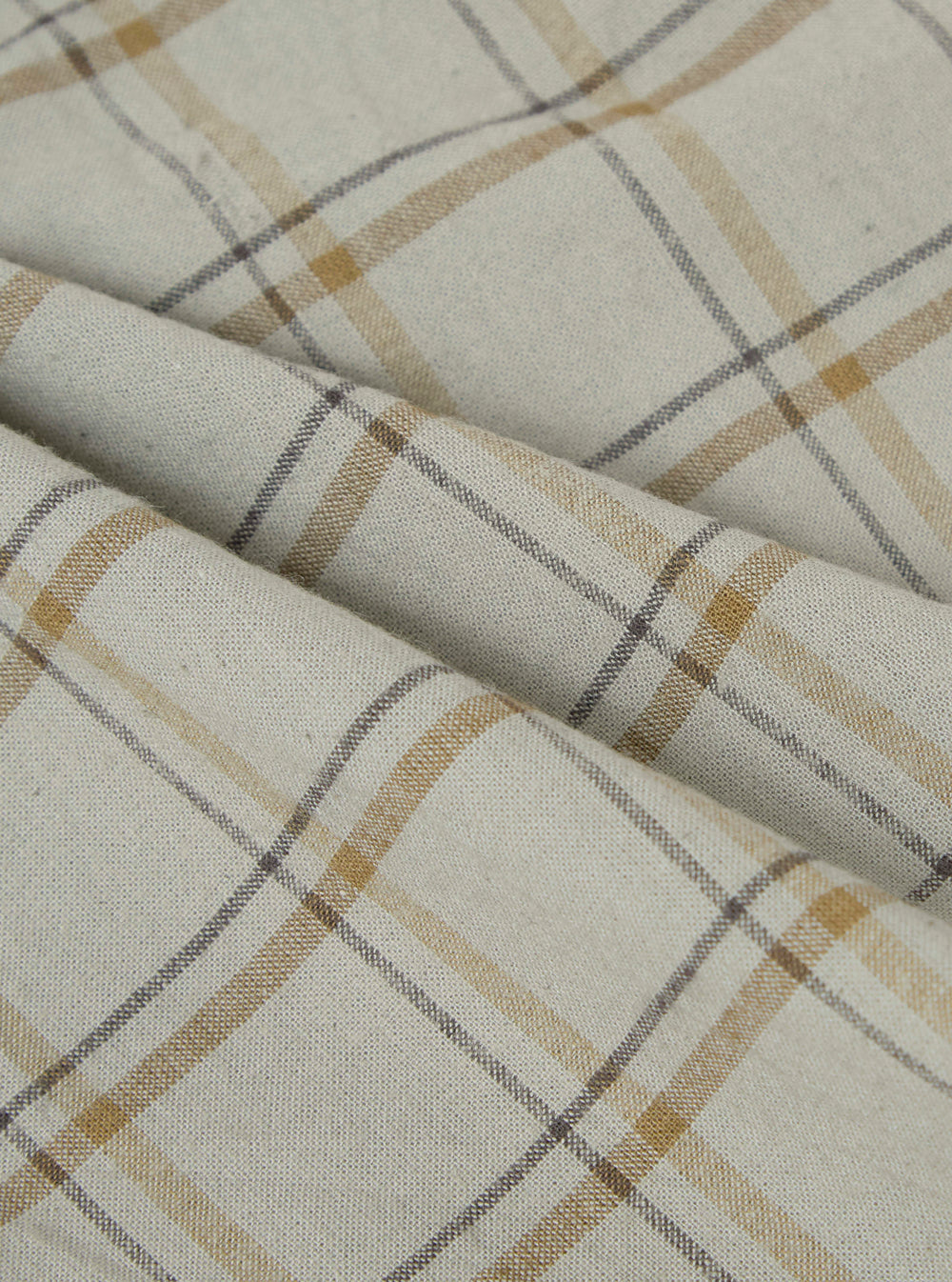 Close-up of the Multi PJ Plaid 3 Pack Boxer Short fabric. The material is a light beige with brown and gray plaid lines. The fabric is folded and textured.