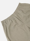 Close-up of Green Tiny Check Boxer Short on a white background. The boxer short features a small green and white check pattern and an elastic waistband.
