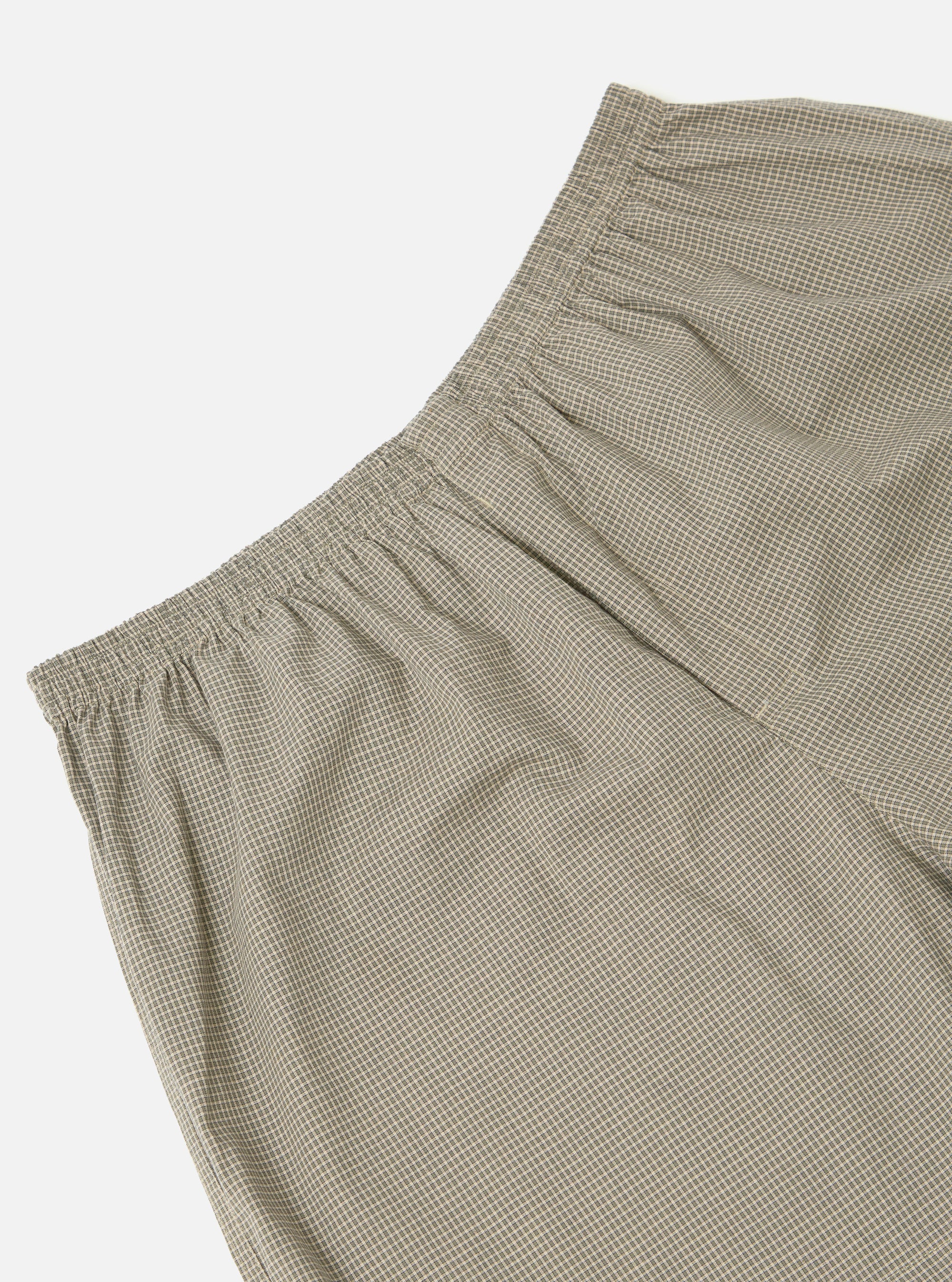 Close-up of Green Tiny Check Boxer Short on a white background. The boxer short features a small green and white check pattern and an elastic waistband.