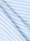 Close-up of the Blue Classic Stripe Boxer Short fabric. Features light blue and white stripes in a soft cotton blend. The material is folded on a white surface.