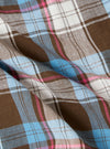 Close-up of the Blue/Brown Check 3 Boxer Short fabric. Features a blue, brown, and white plaid pattern. The material is slightly wrinkled.
