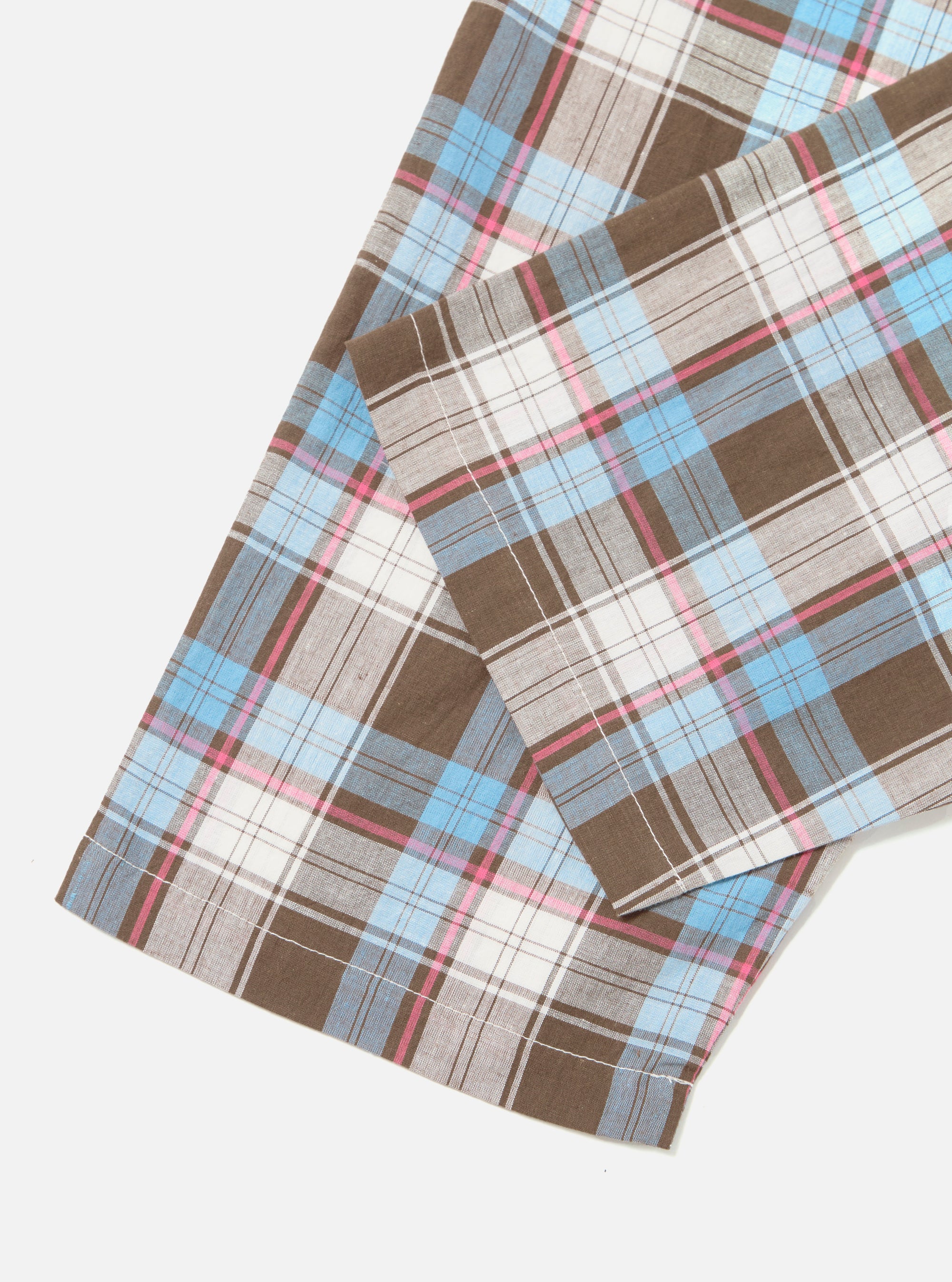 Close-up of the Blue/Brown Check 3 Long Pyjama Set on a white surface. The fabric features a blue, brown, and pink plaid pattern.