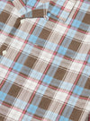 Close-up of the Blue/Brown Check 3 Long Pyjama Set. Features a blue, brown, and pink plaid pattern on a white background. The fabric is neatly folded on a white surface.