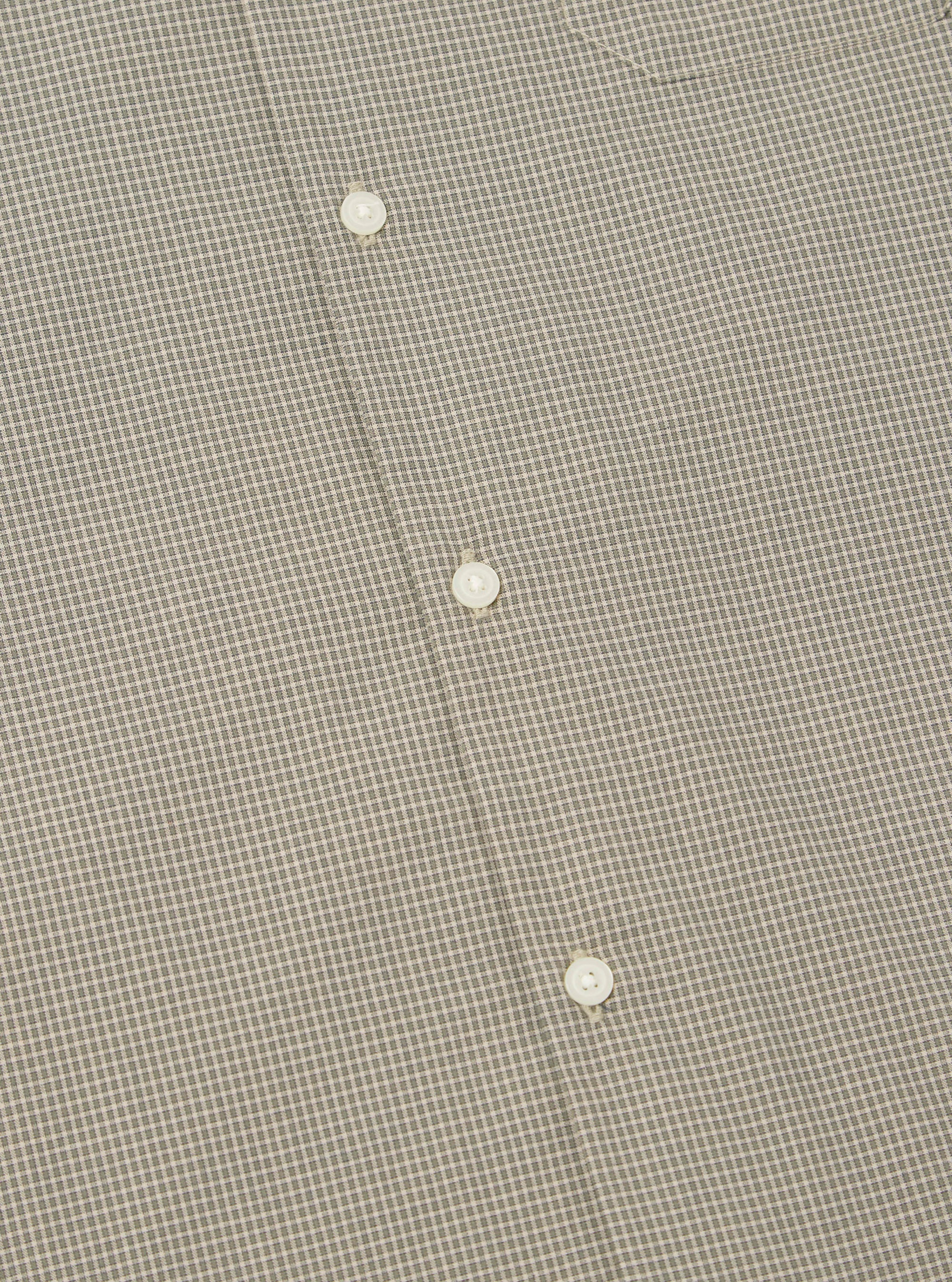 Close-up of the Green Tiny Check Long Pyjama Set, showing the fabric's small check pattern and white buttons. The background is a plain surface.