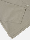 Close-up of the Green Tiny Check Long Pyjama Set. The fabric is a soft green and white check. The set is folded on a white surface.