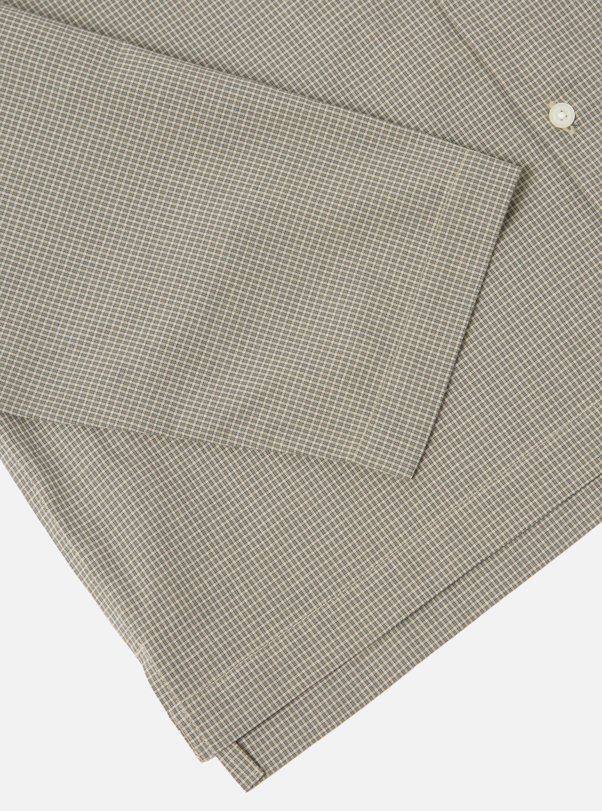 Close-up of the Green Tiny Check Long Pyjama Set. The fabric is a soft green and white check. The set is folded on a white surface.