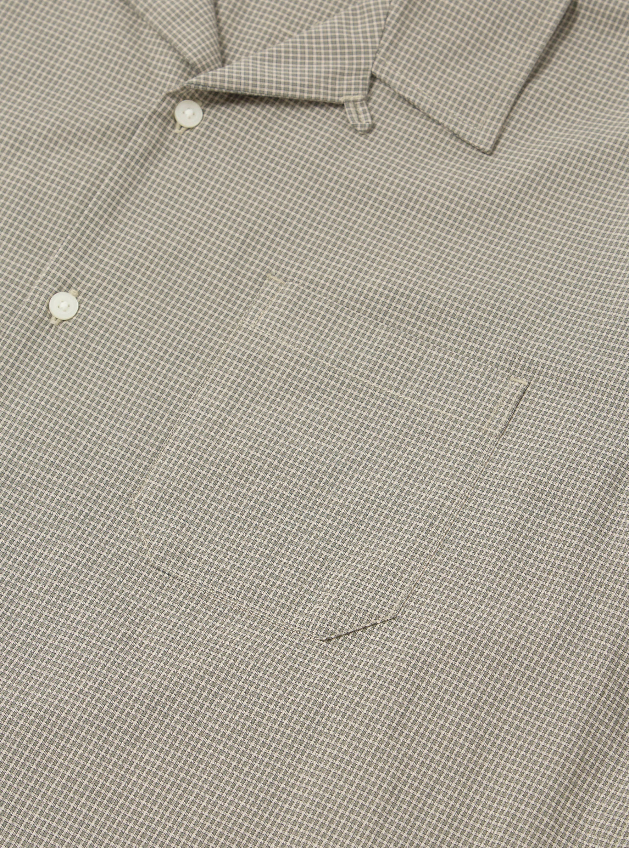 Close-up of the Green Tiny Check Long Pyjama Set top. The fabric is a soft green and white tiny check pattern. Features a pocket and button detail.