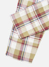 Close-up of the Red/Brown Kip Check Long Pyjama Set. The fabric features a red, brown, and blue check pattern on a white background. Shot on a white surface.