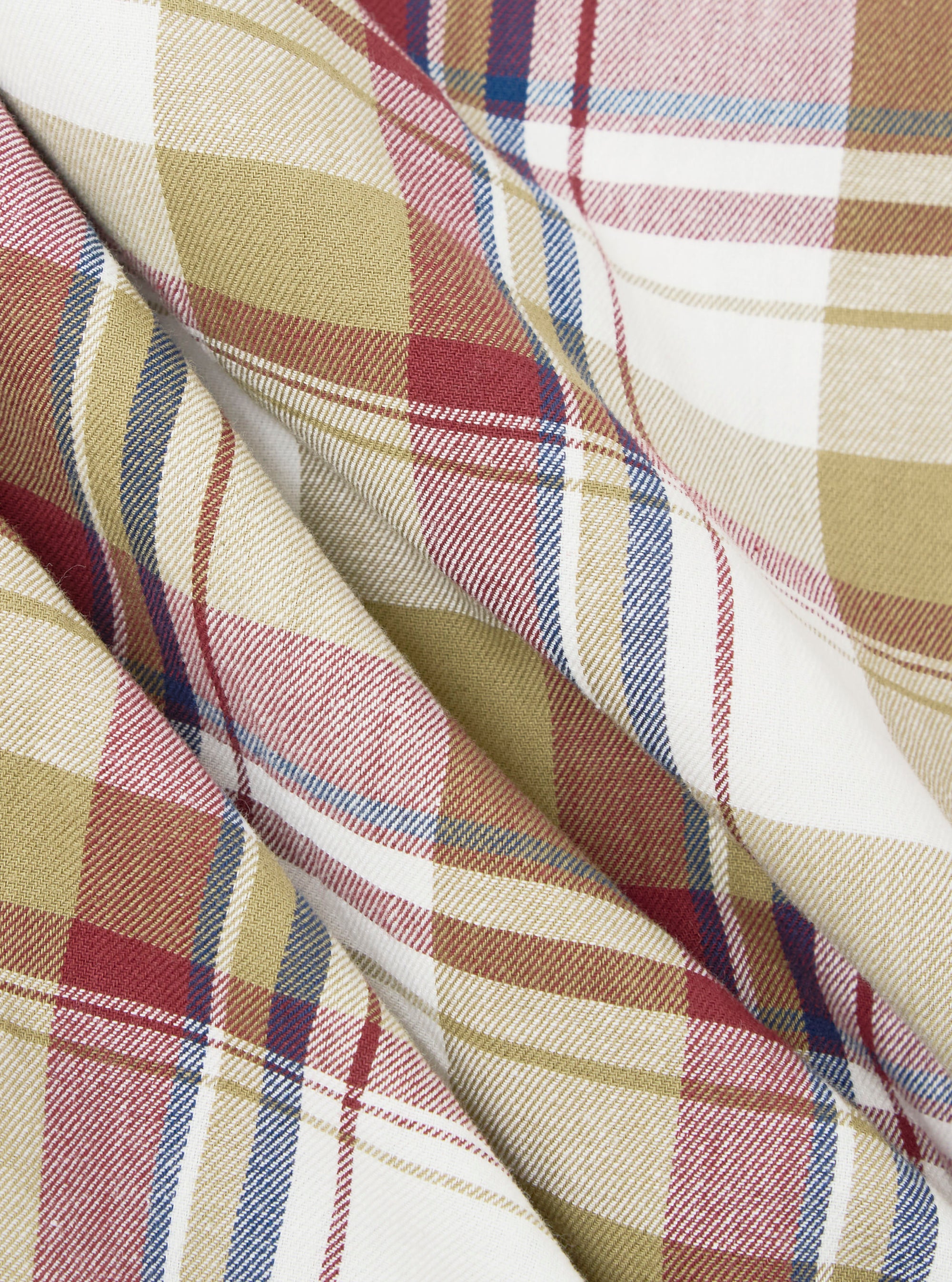 Close-up of the Red/Brown Kip Check Long Pyjama Set fabric. The soft, brushed cotton features a classic red, brown, and blue check pattern on a white background. 