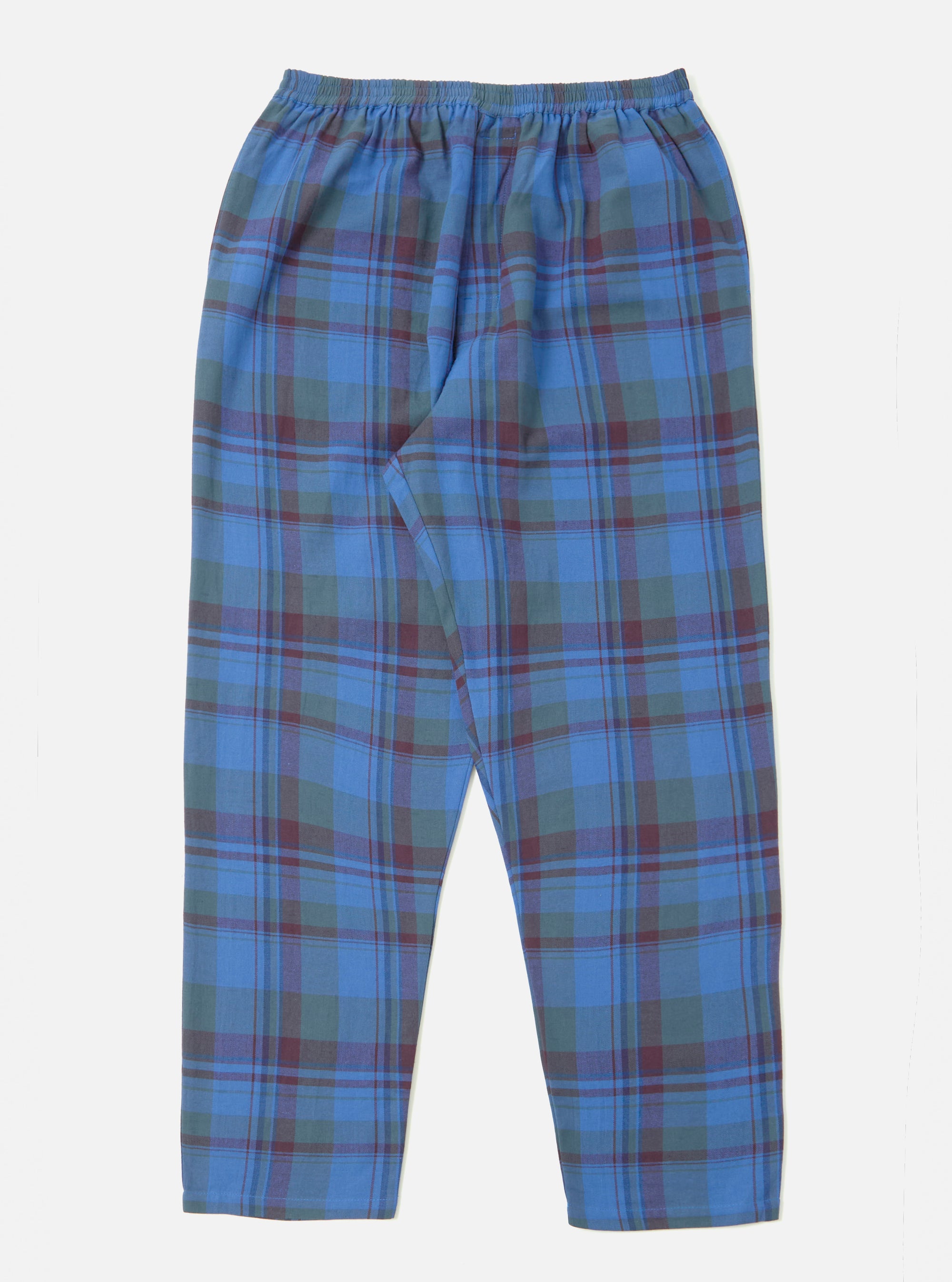 Close-up of the Blue Kip Check Long Pyjama Set pants on a white background. The blue, green, and maroon plaid pants have an elastic waist.