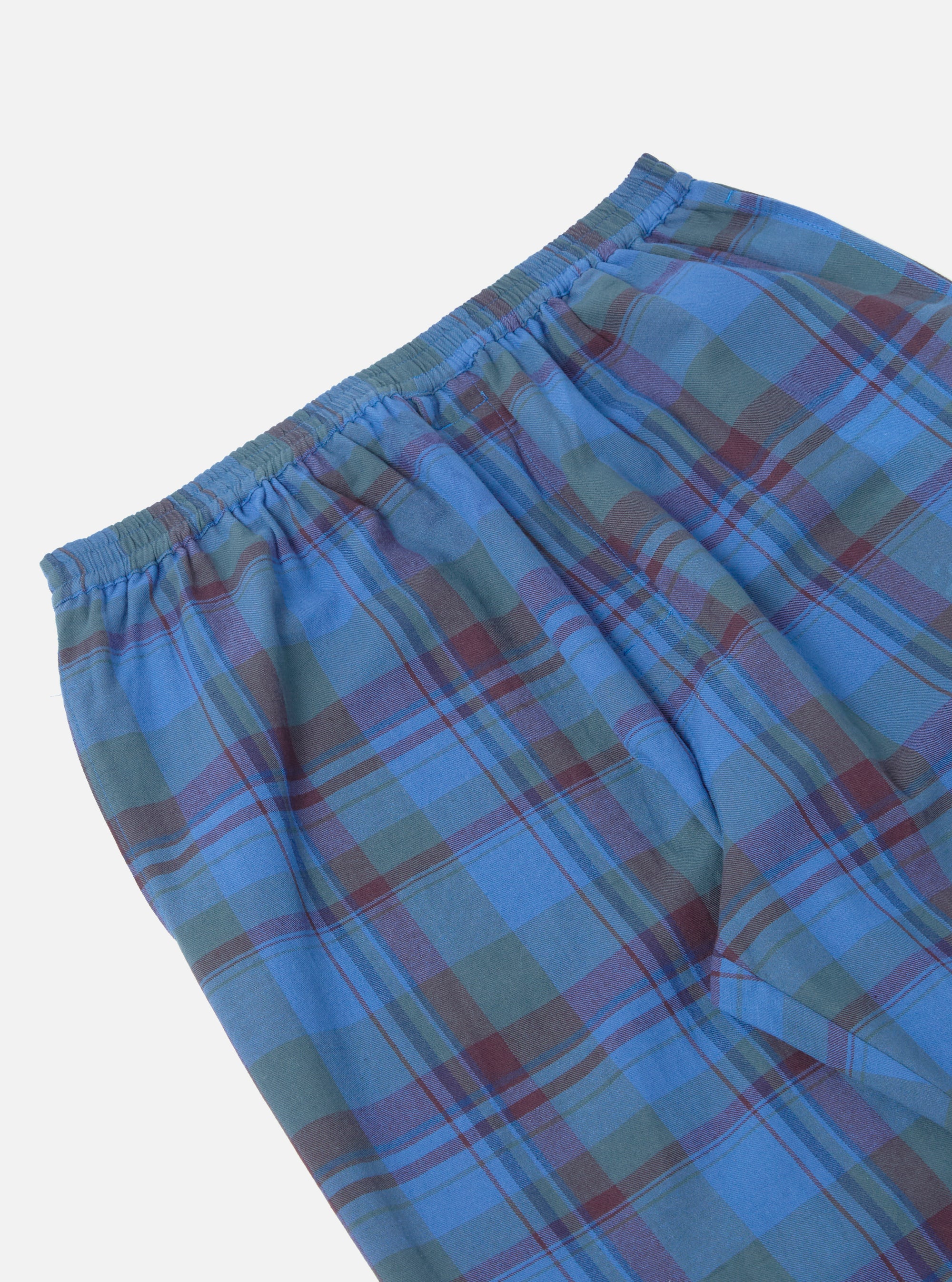 Close-up of the Blue Kip Check Long Pyjama Set pants, showcasing the blue, green, and maroon plaid pattern and elastic waistband on a white background.