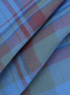 Close-up of the Blue Kip Check Long Pyjama Set fabric. The blue, brown, and green plaid material is folded, showing the texture and pattern.