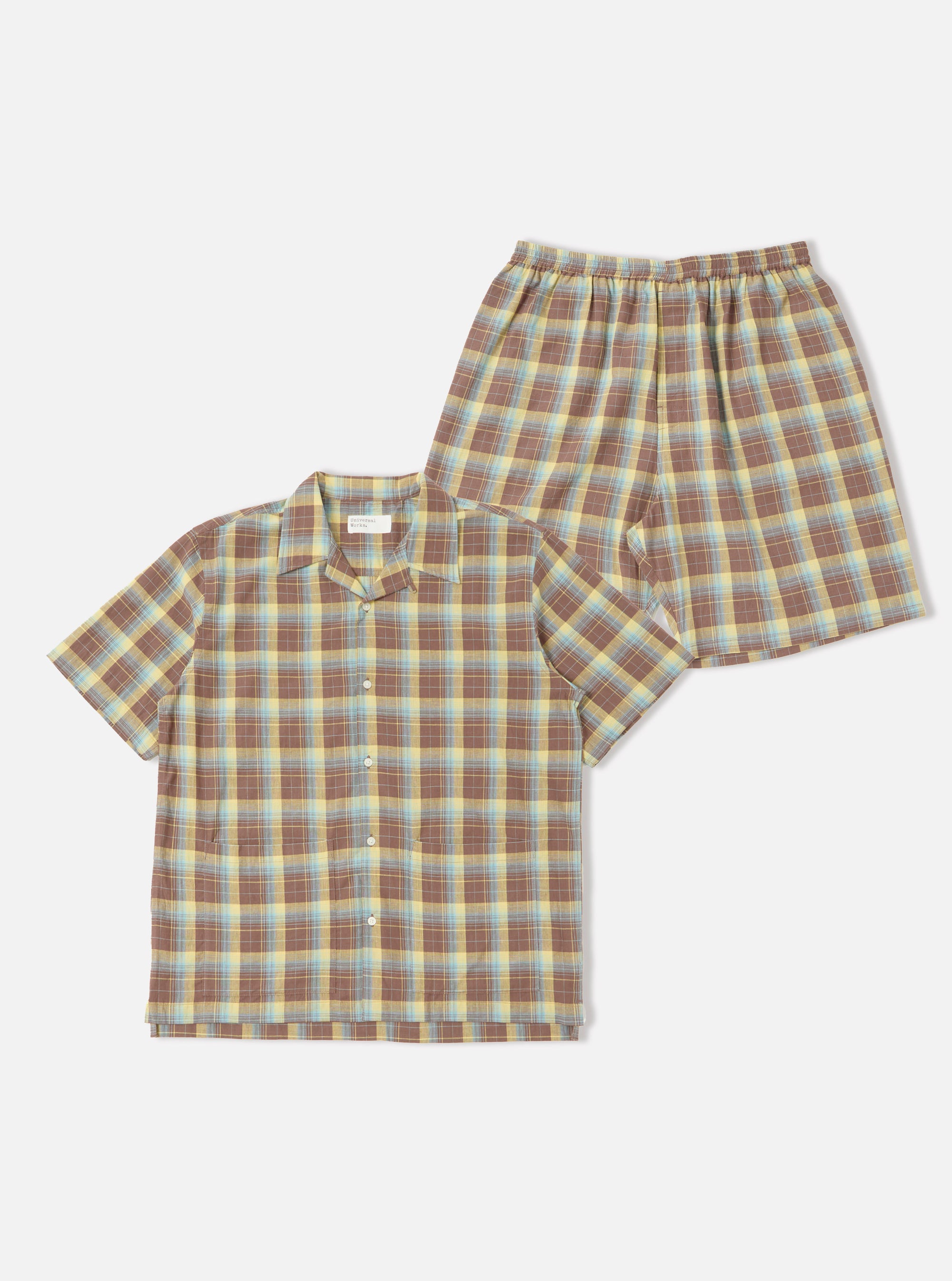 Studio shot of the Yellow/Brown Check Short Pyjama Set. The set features a yellow, brown, and blue check pattern. The background is a plain white.