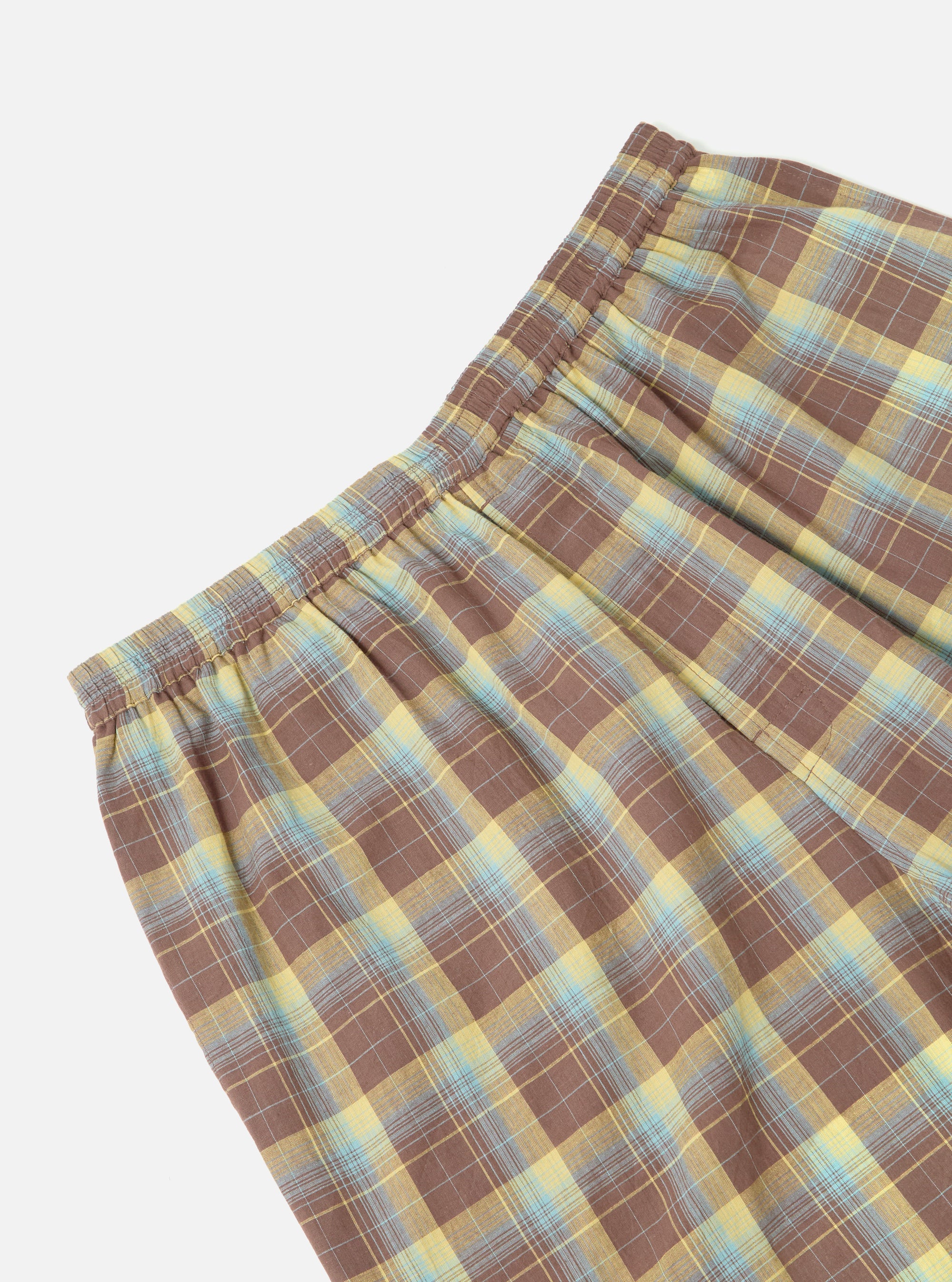 Close-up of the Yellow/Brown Check Short Pyjama Set. The shorts feature a brown, yellow, and blue plaid pattern. Elastic waistband. Shot on a white background.
