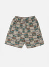 The Green Patchwork Madras Pyjama Short, featuring a green, brown, and white plaid pattern, is displayed on a white background. The shorts have an elastic waistband.