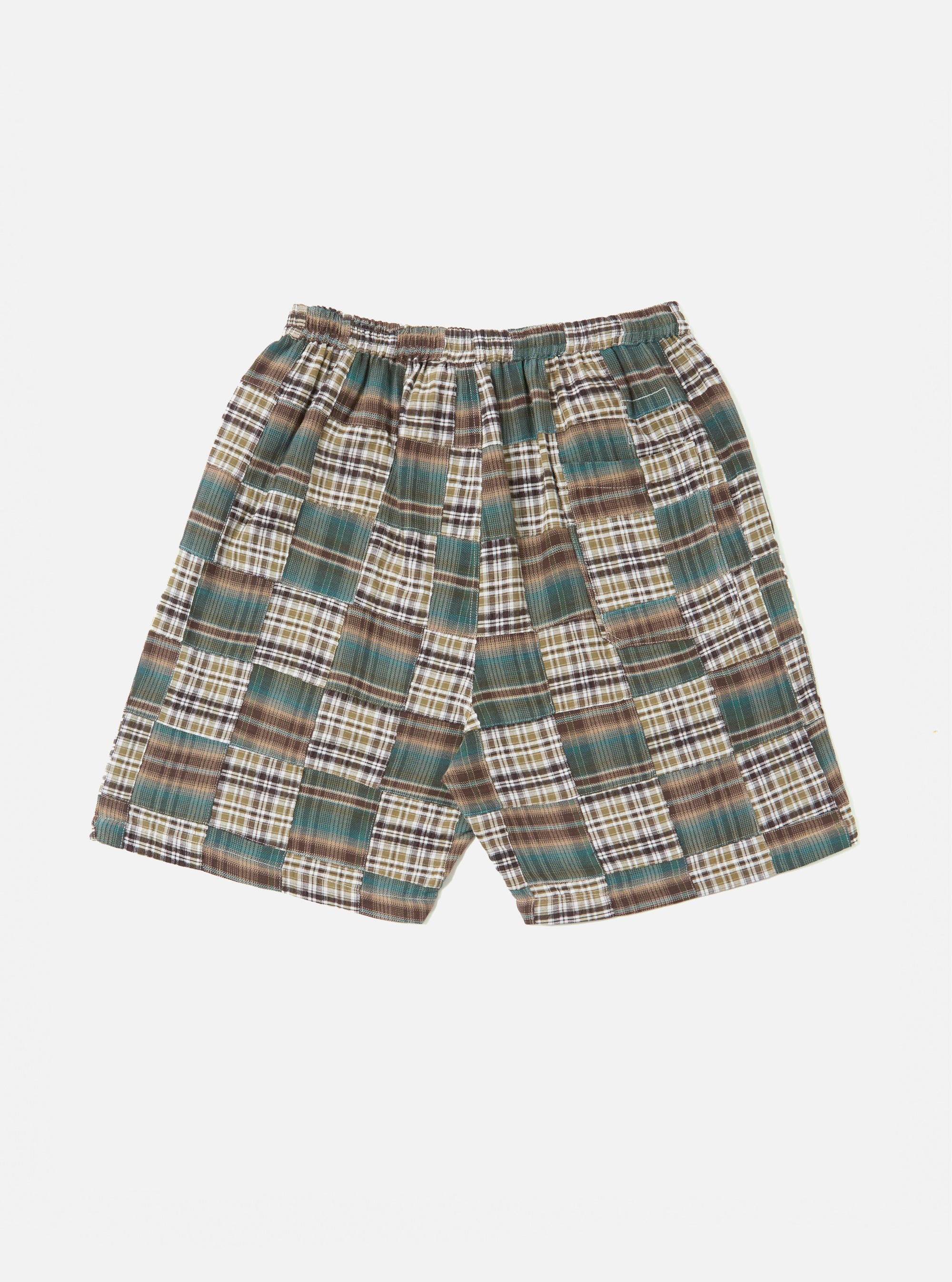 The Green Patchwork Madras Pyjama Short, featuring a green, brown, and white plaid pattern, is displayed on a white background. The shorts have an elastic waistband.