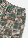 Close-up of the Green Patchwork Madras Pyjama Short on a white background. The shorts feature a patchwork design with green, brown, and white plaid patterns.
